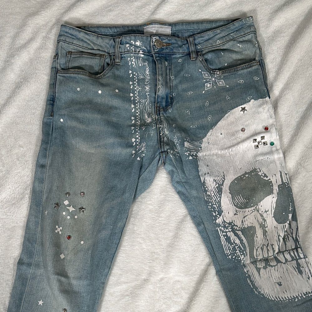 Lifted Anchors Men's Blue Skull Print Jeans with Bold Colored Jewel Accents!